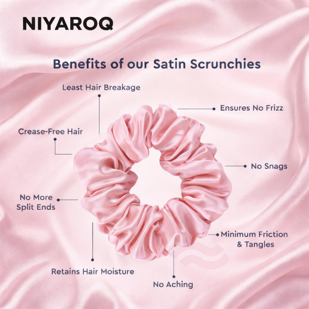 Close-up of the NIYAROQ satin scrunchie showing the smooth, soft fabric texture